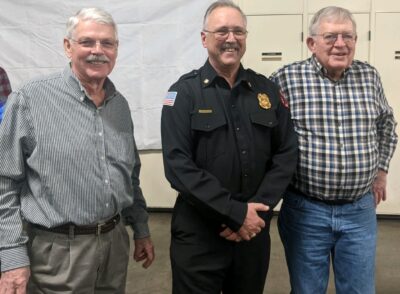 Tom Watkins, Chief Kirk Noffsinger and Jack Plotz at department Christmas party.